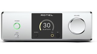 Rotel DX-3 headphone amplifier with front volume knob and headphone jack, compact hi-fi unit