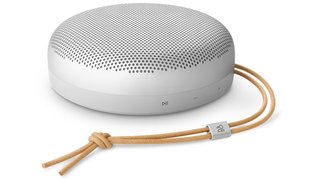 Compact white Bang and Olufsen Beosound A1 portable Bluetooth speaker with leather strap