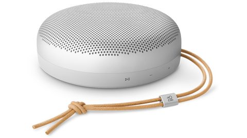 Compact white Bang and Olufsen Beosound A1 portable Bluetooth speaker with leather strap